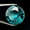 Dieser blau grüne Edelstein in runder Form ist ein Turmalin im Brillant Schliff.